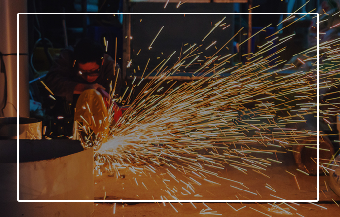 man-using-a-large-welding-machine-generating-great-sparks